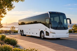 AI-generated illustration of a white charter coach overlooking a California bay at sunrise.